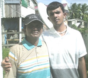 Joshua Bhudial (right) and his father Chandradat Bhudial