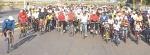 Riders led by Dr. Frank Anthony, Dr. Leslie Ramsammy, Dr. Ashni Singh and Hector Edwards commence yesterday’s Historic ‘The Big Ride’ at the University of Guyana Public Road Junction. (Franklin Wilson photo) 