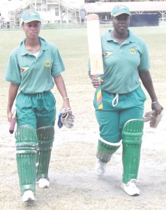 Top scorer Gale (right) and Van Sertima leave the field after their fighting last wicket stand for Guyana yesterday.