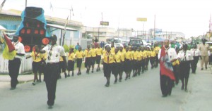 The newly formed Linden Scout Group marches through the streets of the mining town.