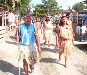 Amerindians from the Surinamese border community of Apoera walk in Orealla after performing at the Heritage Day celebrations. 