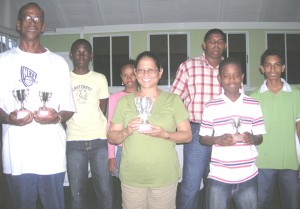 Ghir-Somar (centre) is all smiles as she displays the winning trophy with the other contestants. Thomas is to her left while Gaul is to her right.