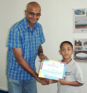 GWI Chief Executive Chandisingh presents a participant with a certificate of appreciation.