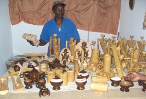 Michael Alleyne examines items in his booth 