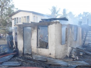 The remains of a house as firefighter extinguished the fire