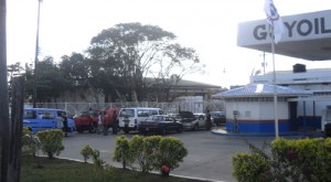 Disgruntled Guyoil customers with their affected vehicles at the Providence station.