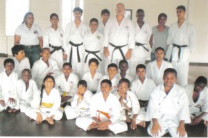 Sensei Amir Khouri (3rd R standing) poses with Natalie Gibson (3rd R), Althea King (2nd R) and Maria Wilkinson ((extreme L back row) moments after the curtains came down on the national camp.