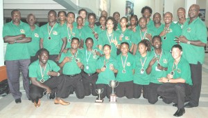 Flashback: The Caribbean champions pose with their trophies and medals for Kaieteur Sport shortly after touching down at the Cheddi Jagan International Airport last year. 