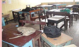 The scene in Form 3C yesterday at the East Ruimveldt Secondary  School. It has been in this state where bags and books were left  abandoned after mass hysteria broke out Thursday.
