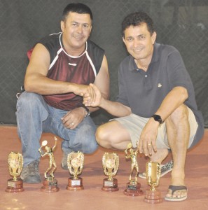 Over 35 and 45 Doubles champions Wayne & Clinton Alphonso display their hardware following the presentation ceremony last Monday. 