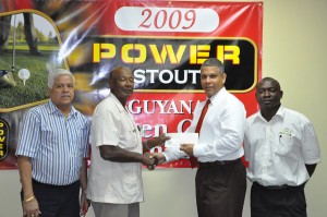 Banks DIH Sales and Marketing Executive, Carlton Joao (second, right) hands over the sponsorship cheque to President of the Lusignan Golf Club, Mel Sankies in the presence of Power Stout and Premium Beer Consultant, Michael Fung (left) and Public Relations Officer of the Lusignan Golf Course and Communications Manager of Banks DIH, Troy Peters.