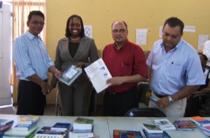 Officials from the Health Sector receive the donation from the FXB representative. 