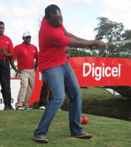 Digicel CEO Gregory Dean tees off a  shot to signal the start of competition  yesterday, at the Lusignan Golf Course.