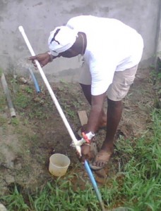 A GWI official repairing a broken main in the Diamond area last Sunday