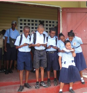 While prayer has not been part of school life for  several years, yesterday these students were seen reading  their bibles on the East Ruimveldt Secondary school steps.