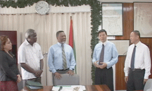 Foreign Affairs Minister, Carolyn Rodrigues-Birkett, Minister of Transport and Hydraulics, Robeson Benn, Prime Minister Samuel Hinds, Chinese Ambassador Zhang Jungao and representative of the Chinese Delegation, Hung Shawen, chat after the singing of the contract.