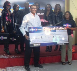 Janelle Joseph with  the $2.5M cheque.