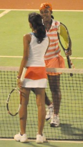 National Ladies champion  Carol Humphrey (foreground) shakes  the hand of her opponent Aruna Ramrattan shortly after defeating her last Friday.
