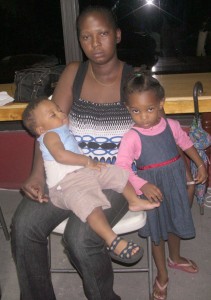 The distraught Onika Victor and her two children. 