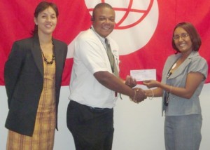 Manager of Products and Marketing Mrs. Jennifer Cipriani-Nelson (right) presents the cheque to GHB Vice-President Rawl Davson in the presence of Assistant Secretary/Treasurer of the Board Tricia Fiedtkou last Wednesday.
