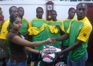 Victoria Kings caption Tichard Joseph (right) collects  some of the gear from Giftland’s Teresa Narine. 