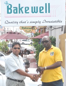 General Manager of Bakewell Rajin Ganga (left) hands over cheque to Aubrey Shanghai. 