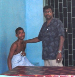 The tortured teen and attorney Khemraj Ramjattan at the Vreed-en-Hoop Station 