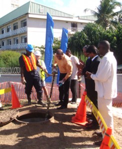 President Bharrat Jagdeo participates in the symbolic cable pulling, marking the landing of the Guyana shore-end of a submarine fibre-optic cable, as senior executives of GT&T cheer.   