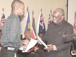 Junior Mercier of Haiti makes a presentation to Suriname’s Runaldo Venetiaan.