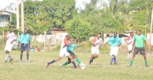 Intense action in the Mocha Champs / Yarrowkabra Stag Beer League match on Sunday at the Grove ground, East Bank Demerara. (Franklin Wilson photo)