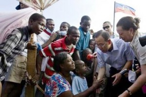 UN Secretary-General Ban Ki-moon (2nd right) speaks with displaced Haitians in front of the Haitian National Palace during his trip to Port-au-Prince yesterday. (REUTERS/Logan Abassi/UN Photo/Handout)