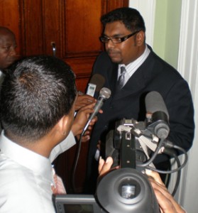 Minister of Housing, Irfaan Ali, speaking to reporters shortly after the walkout by Opposition parties from Parliament yesterday.