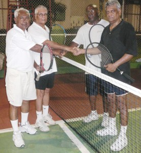 The victorious pair of Maxie Fox / Dr. Steve Surujbally (right) shakes hands with the pair of Roy Rampersaud / Bobby Khan after their win.