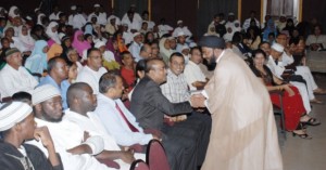 Moulana Sayeed Mohamed Tasdiq greeting Head of State Bharrat Jagdeo at the Evening of Qaseedas and Ghazals, Theatre Guild.