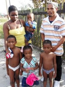 Kenny Williams, his wife,  Onica and their four children