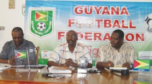 Administrator of the Super League, Kirk Douglas (centre) briefs the media of matters pertaining to the League and the Women’s world cup qualifiers. Lawrence Griffith is left, while GFF Vice President Franklin Wilson is at right. 