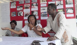 University of Guyana Communication lecturer, Terrence Esseboom, drills Guyana Revenue Authority Communications Officer, Melissa Baird on a revenue issue at UG Career Day activities yesterday