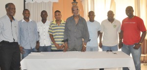 Alpha United President Odinga Lumumba (4th right) flanked by club executives and some of the Jamaican players at yesterday’s presser. From left, Clifton Bobb, Howard Lowe, Troylan Williams,  Peter Gordon, Jermaine Allen, Steve Ninvalle (PRO) and Aubrey ‘Shanghai’ Major.