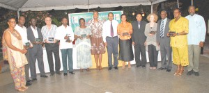 WINNER'S ROW!!!! Grace Jackson and Minister of Culture, Youth and Sport,  Dr Frank Anthony (centre) are flanked by the various awardees and other  GOA officials. From left Dr Karen Pilgrim, Rawle Toney, Colin Boyce,  Charles Corbin, Jeanette Lovell, Mary Chung, GOA President, K. A. Juman Yasin,  Josephine Whitehead, Ivor O'Brien, Shirley Hooper and Hector Edwards.