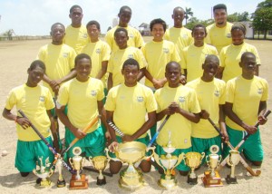The Hikers junior team, decked in their new uniform, compliments of Woodpecker, pose with their hardware which was won last year.