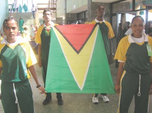 FLASHBACK!!! Guyanese athletes from last year’s IGG contingent proudly displays the National Flag upon entering the sports arena in Suriname. The same national spirit will be displayed in French Guiana when the local team arrives.