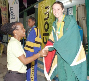 Draped in the Golden Arrowhead, Jessica Stephenson collects her accolade after winning the Carifta gold medal