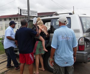 A relative prepares to take Matilda Hamsingh to a private hospital