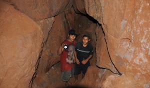 Young Amerindians search for gold in a tunnel in Marudi  Mountain where a proposed large scale mining project is likely.