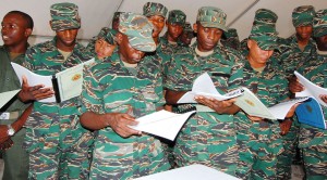 Several soldiers peruse the sample booklets