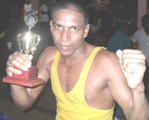 Rep. boxer Nankumar Singh displays his trophy.