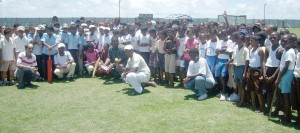 Students and Teachers pose for a photo op just before the start  of play yesterday, at the Uitvlugt Community Centre ground.