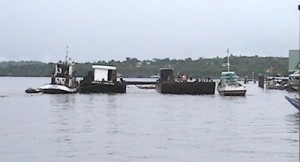 The two barges trying to get the sunken vessel out of the Essequibo River. 