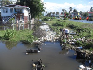 A Lusignan resident tries his utmost to clear obstacles that are contributing to the situation.