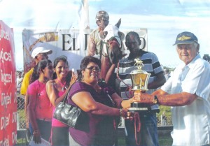 A representative of Mr. R. Bharat collects the  trophy for Lyana’s last win at the Kennard Memorial meet.  